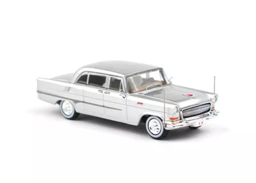 Silver luxury sedan diecast model car, front three-quarter view, 1:64 scale