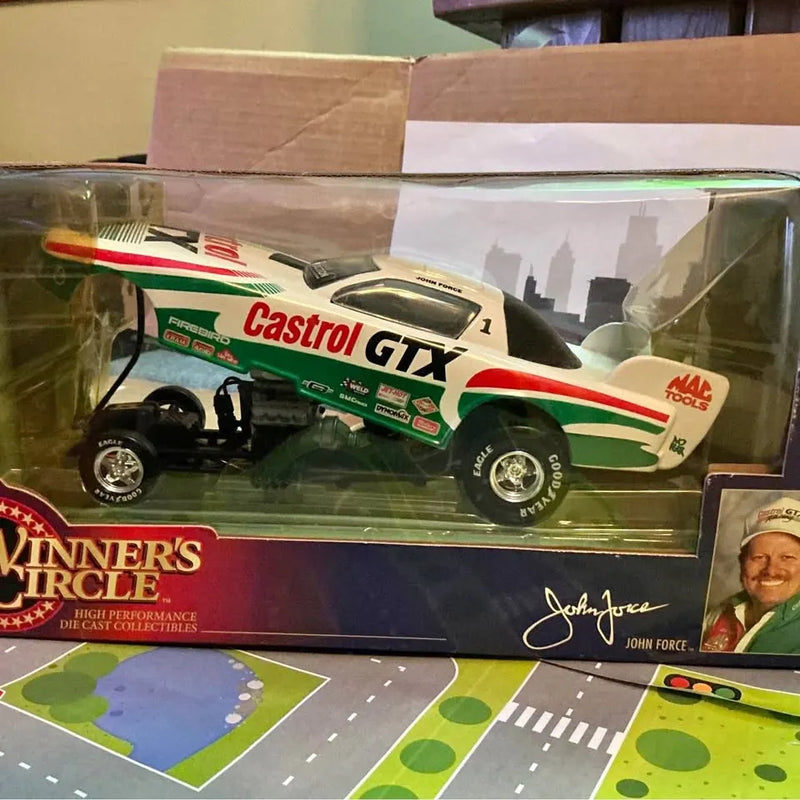 Diecast race car model in display box, green white red livery and racing number.