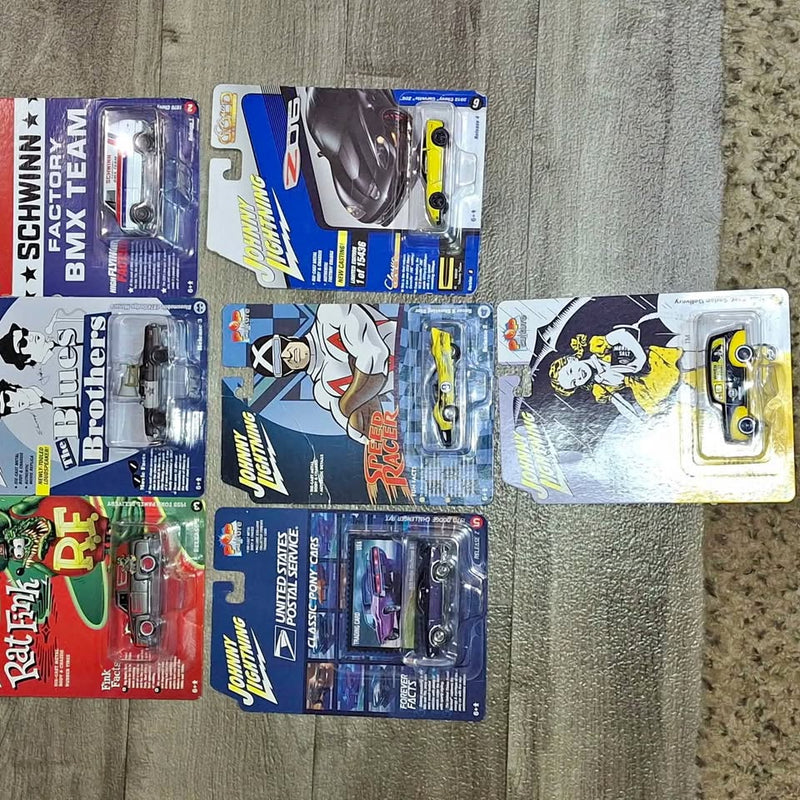 Diecast car collectibles in blue blister boxes, multiple designs