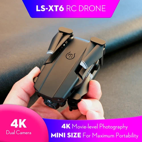 Compact RC drone with dual camera module and foldable arms, gray body