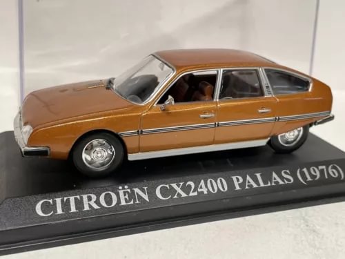 Diecast model car with brown Citroën CX2400 Palas body, front three-quarter view