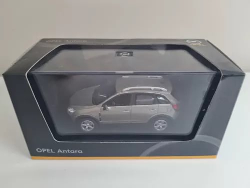 Gray diecast SUV model car in display box, scale 1:43