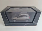 Gray diecast SUV model car in display box, scale 1:43