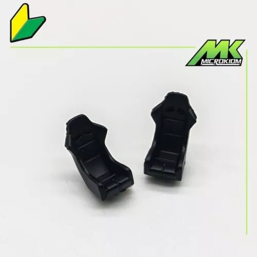 Pair of black diecast model car seat parts, modified sports seats