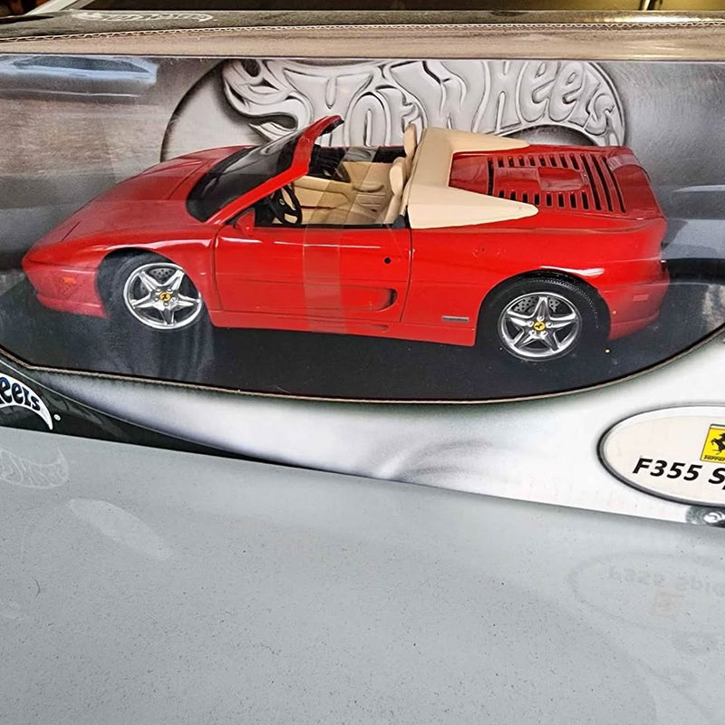 Red Ferrari F355 Spider 1:18 diecast convertible car with black top and chrome wheels