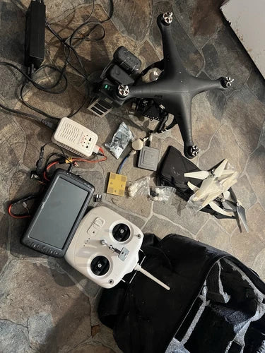 Quadcopter drone with handheld controller, spare parts and accessories, plus hard case