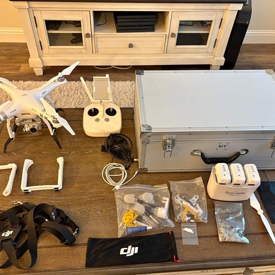 DJI Phantom 3 Advanced drone kit with controller, propellers, and charging accessories