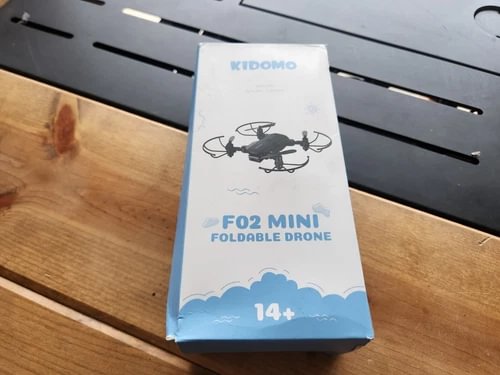 KIDOMO F02 Mini foldable drone gift box with drone illustration