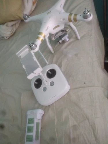 DJI Phantom 3 4K pro drone, white quadcopter with camera and four propellers