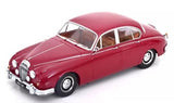 Red classic diecast car model with brown interior, front 3/4 view.