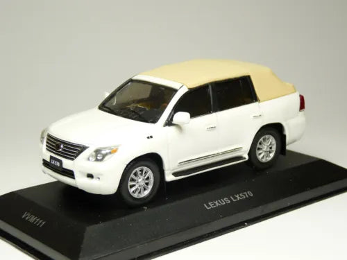 Lexus LX570 diecast model car, white body with tan roof, on black display base