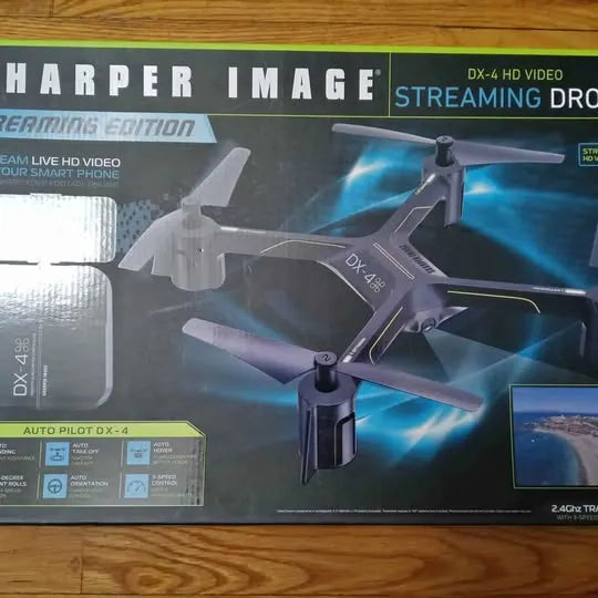 Foldable quadcopter drone with four propellers shown on product box