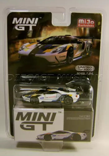 Diecast racing car model in clear blister packaging, MINI logo, multicolor livery.