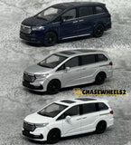 1:64 diecast minivan model cars, dark and white, side views