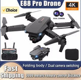 Black foldable quadcopter drone with dual cameras and remote control transmitter