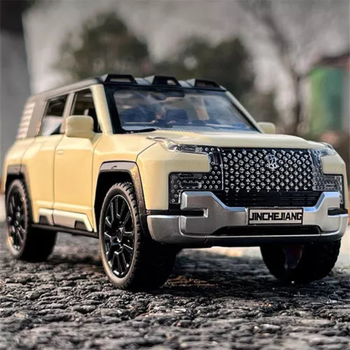 Yellow off-road diecast toy car model, front grille and headlights in 3/4 view
