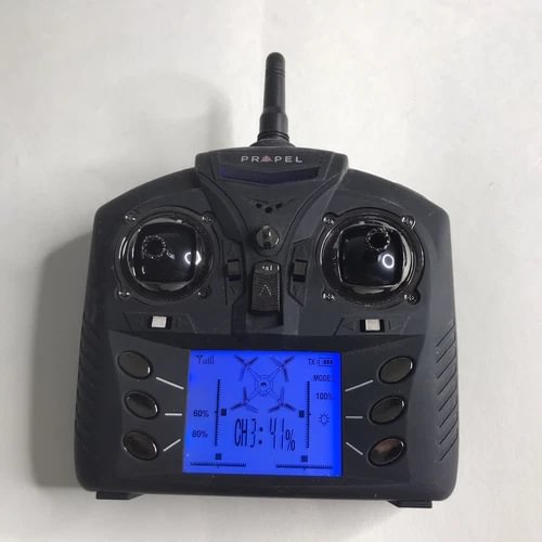 Black drone remote controller with LCD screen and twin joysticks