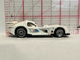 White diecast race car with blue racing logo, side view, black wheels
