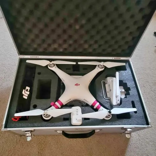 DJI Phantom 3 Standard quadcopter drone, white with four propellers, in open case