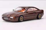 Brown 1/64 scale BMW 850 CSI diecast car model, front 3/4 view