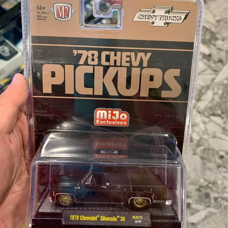 1978 Chevy Silverado diecast pickup truck in package, dark body with gold wheels