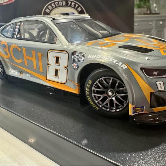 NASCAR diecast race car in black and orange with large #8 on the door and front fender