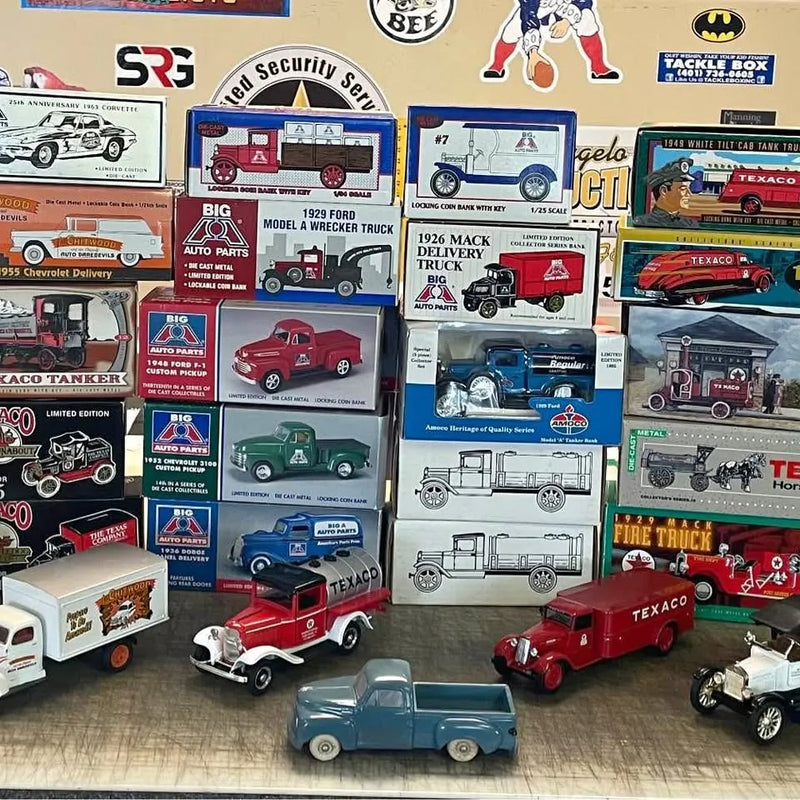 Diecast vehicle bank display with red, blue, and white toy trucks and cars