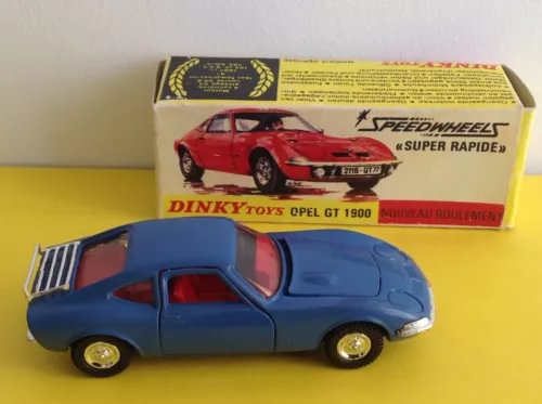 Blue diecast coupe model car with red interior and gold wheels