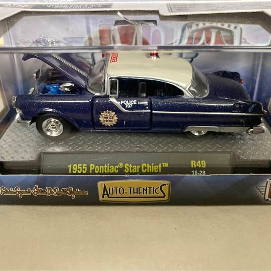 Blue 1955 Pontiac Star Chief diecast car with cream roof, in display box