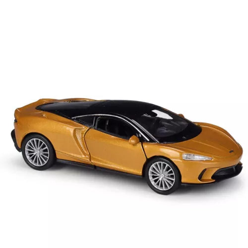 Gold McLaren GT diecast model car toy with black wheels and windows