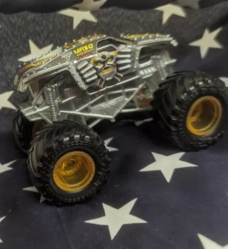 Monster Jam MAX-D diecast monster truck, metallic gray body with yellow wheels