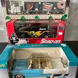 Die-cast metal toy car in blue with white top, boxed display