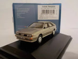 Sable brown metallic die-cast car model with front three-quarter view on display base