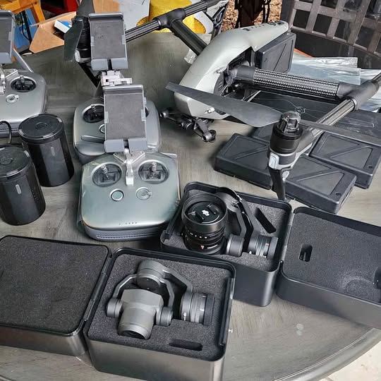 Folding drone controller with camera gimbal and accessories in protective cases