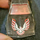 1/64 diecast toy car with red-and-white eagle decal on black hood