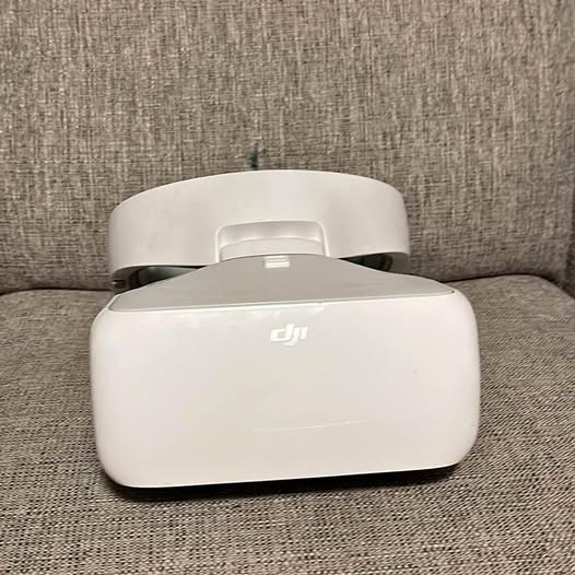 White DJI VR drone goggles headset with front display window