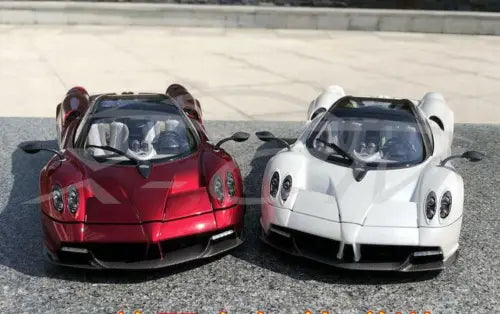 Red and white diecast supercar model cars with front headlights