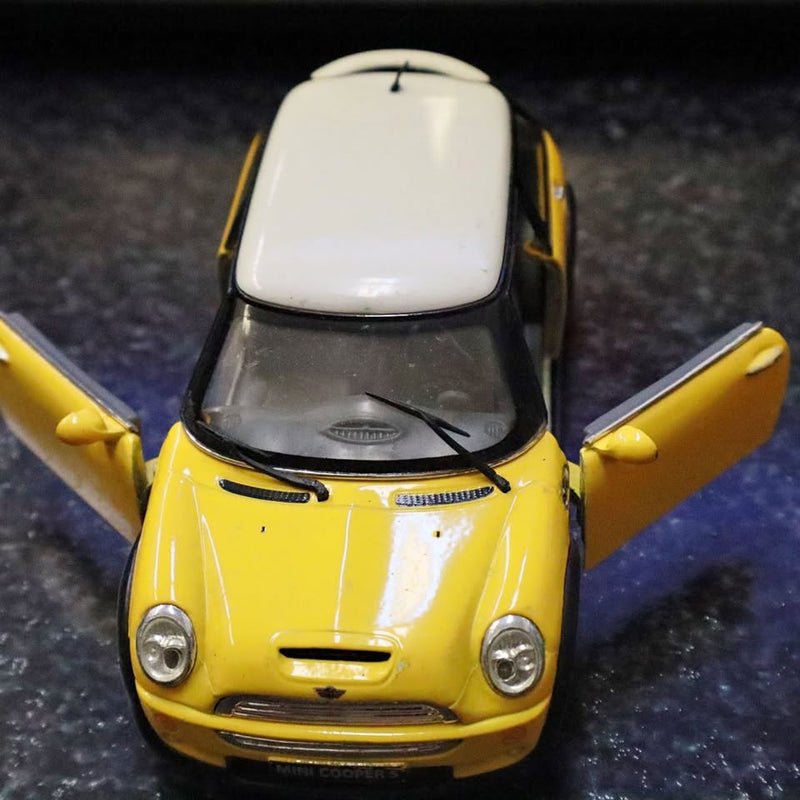 Yellow diecast toy car model with front view, side doors open