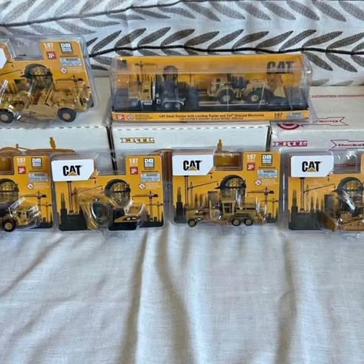 CAT 1/87 diecast construction toy trucks in blister packaging, Wilmot SD set
