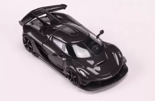Black sports diecast model car with rear wing and open engine details