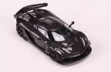 Black sports diecast model car with rear wing and open engine details