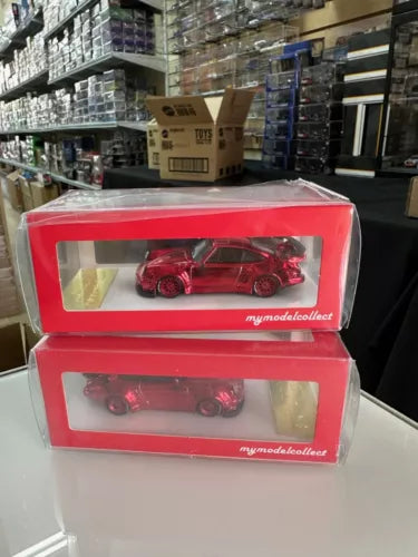 Red diecast sports car model in display box, front view
