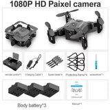 Foldable mini quadcopter drone with 4 propellers, dark gray body