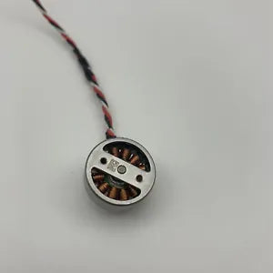 Round drone motor with internal copper contacts and attached red-black wires