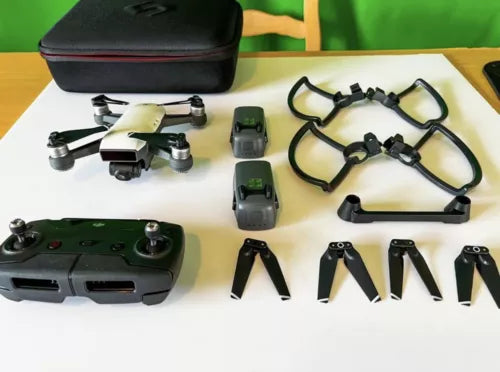 DJI Spark drone with batteries, propellers, and carrying case