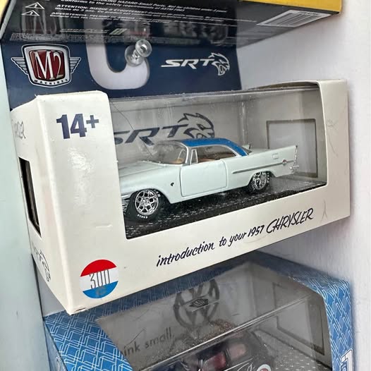 White classic diecast car in M2 retail box with SR T graphic and 14+ age label