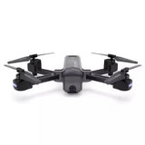 Quadcopter drone with mounted camera, four rotors and dark body