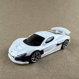 White Hot Wheels style diecast sports car with black grille and tinted windows