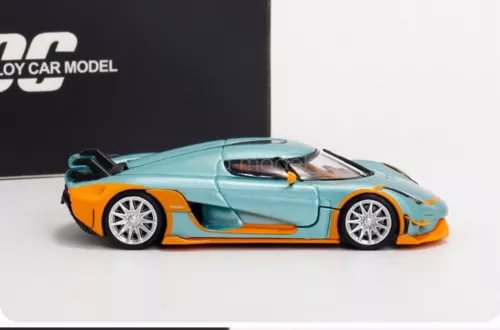 1/64 scale diecast toy car in teal with orange accents, open cockpit, side view