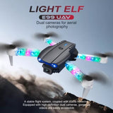 Grey quadcopter drone with dual cameras and blue LED lights, four propellers